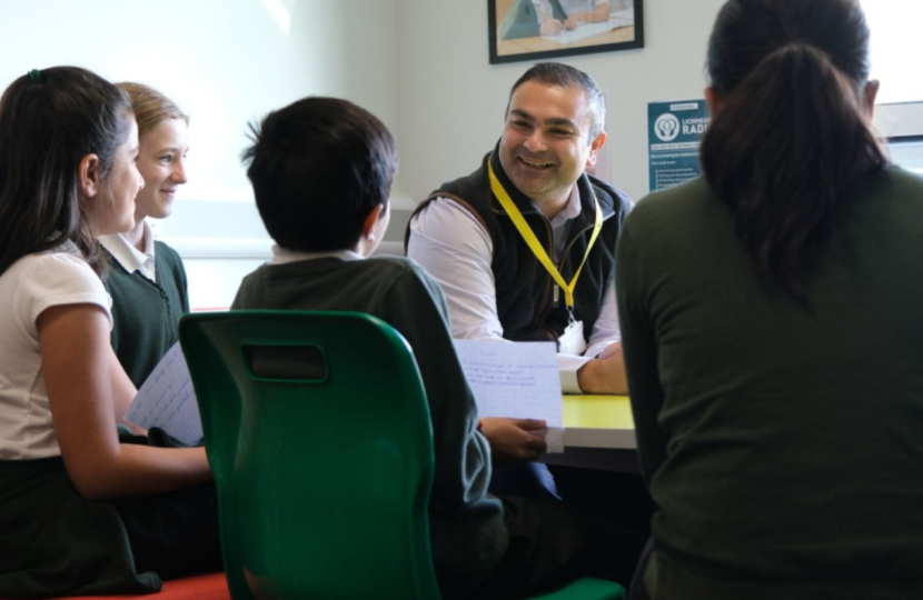 Peter visiting a local school