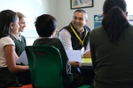 Peter visiting a local school