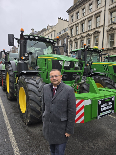 Peter next to a tractor